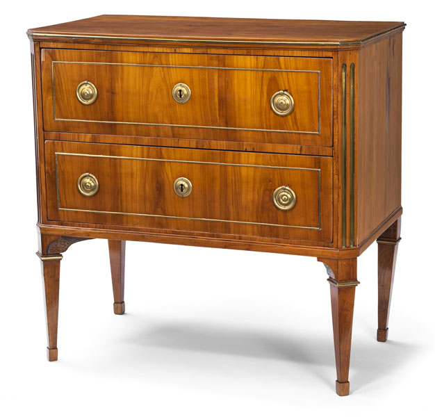 Rectangular body with beveled and chanelled front edges and two drawers on four fluted legs. Rest. Minor damages due to age.