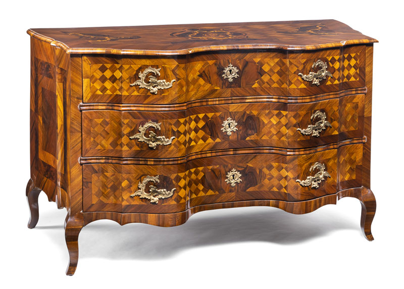 The three side curved body with three drawers with cube marquetry, Rocaille shaped cartouche and monogram 