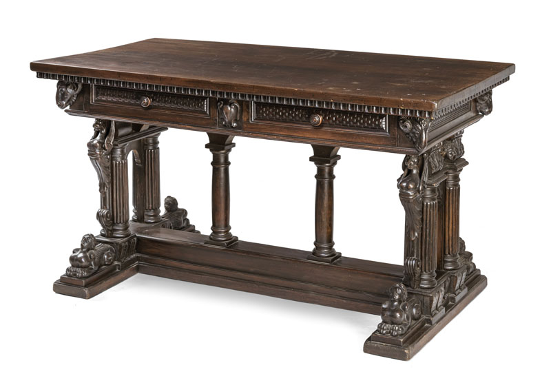Carved and dark painted wood. Rectangular frame with carved ram heads and two side drawers, supported by a structure of various columns, the side panels decorated with caryatids on one side (on opposite side missing), solid base with full-round carved sphinxes. Damages due to age, add., rest.