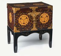 <b>A LACQUER DECORATED CHEST ON A STAND WITH TOKUGAWA CLAN EMBLEMS</b>