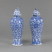 <b>A PAIR OF BLUE AND WHITE PORCELAIN FLORAL SCROLLS AND RUYI VASES AND COVERS</b>
