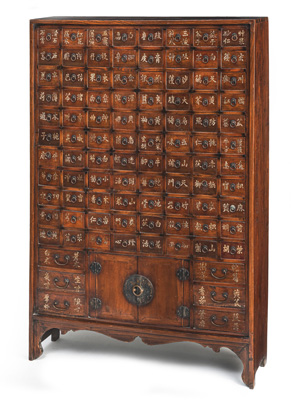 <b>A WOOD APOTHECARY CABINET WITH INCRIBED DRAWERS AND METAL MOUNTS</b>