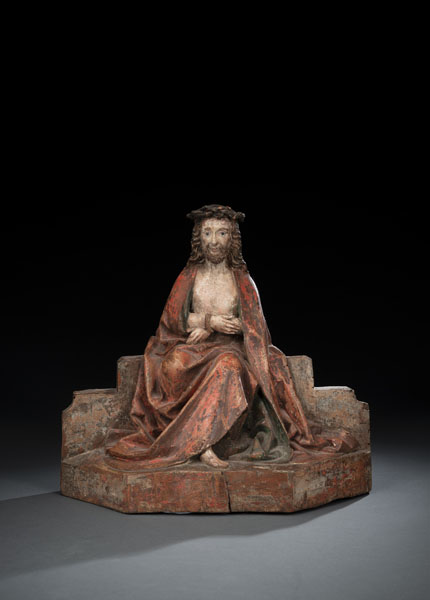 Christ Resting. Chirst seated on a low wall, wrapped in a large robe. Hardwood, carved with hollowed back. Remnants of the old polychromy, overpainted. Crown of thorns worked separately, rest., some age damages.