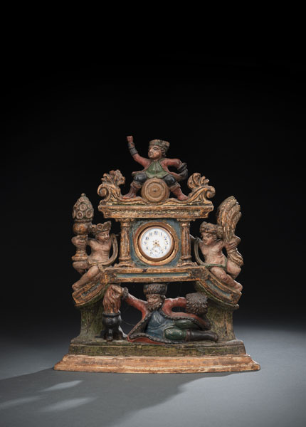 Carved and painted limewood with four figures depicting the seasons. Some retouches and minor restorations. With a metalgilt pocket watch and chain, not working.