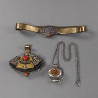 <b>A FIRESTONE POCKET, AN AMULET CASE WITH A CHAIN AND A BELT BUCKLE, PARTLY WORKED IN SILVER WITH CORAL INLAYS</b>