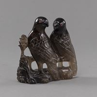 <b>A PAIR OF BIRDS ON ROCK, CARVED FROM SMOKY QUARTZ</b>