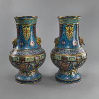 <b>A PAIR OF CLOISONNÉ ‘HU’ VASES WITH LION HEAD HANDLES, DECORATED WITH TAOTIE MASKS AND 