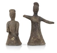 <b>A POTTERY FIGURE OF A DANCING LADY AND A KNEELING FEMALE MUSICIAN</b>