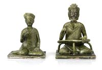 <b>TWO UNUSUAL GREEN GLAZED POTTERY FIGURES OF A SITTING WOMAN AND A MAN</b>