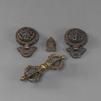 <b>TWO COPPER REPOUSSÉ BELT BUCKLES, A BRONZE VAJRA AND A BRONZE MAHAKALA</b>