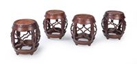 <b>FOUR DRUM-SHAPED WOOD STOOLS</b>