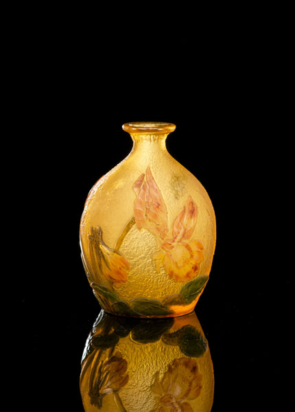 Wheel-carved cameo glass of amber colour with acid-etched floral decor of daffodils (?). Signed in gold on bottom: 