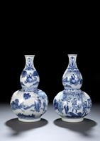<b>A RARE PAIR OF BLUE AND WHITE 'FIGURAL' DOUBLE-GOURD VASES</b>