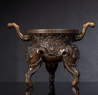 <b>A BRONZE CENSER WITH LOTUS DECORATION ON THREE ELEPHANT HEAD LEGS WITH GLASS INLAYS</b>
