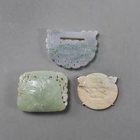 <b>A CARVED JADE AND A JADEITE BELT BUCKLE AND A JADE PENDANT</b>