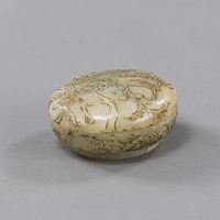 <b>A CARVED AND PART-GILT JADE BOX AND COVER</b>