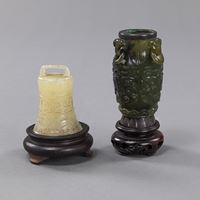 <b>A CARVED VASE WITH SILVER MOUNTS AND A BELL IN ARCHAIC STYLE, BOTH WITH WOOD STANDS</b>