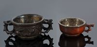 <b>A CARVED ZITAN AND A CARVED HUANGHUALI WINE CUP WITH SILVERED COPPER COVERED WITH SILVER-PLATED COPPER</b>