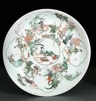 <b>A FAMILLE VERTE PORCELAIN PLATE WITH SEVERAL SCENES OF LADIES IN A GARDEN LANDSCAPE</b>