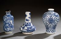 <b>A GROUP OF THREE BLUE AND WHITE DECORATED PORCELAIN SNUFFBOTTLES</b>
