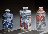 <b>A GROUP OF THREE BLUE AND WHITE AND COPPER-RED DCORATED PORCELAIN SNUFFBOTTLES</b>