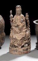<b>A CARVED AND PAINTED WOOD MODEL OF SEATED GUANYIN AND BOY WITH LOTUS</b>