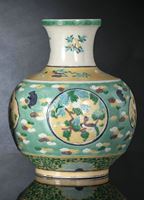 <b>A BISCUIT DAOIST EMBLEM AND FLOWER VASE</b>