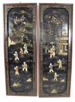 <b>TWO FRAMED SOAPSTONE-INLAID 'PLAYING CHILDREN' WOOD PANELS</b>
