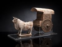 <b>A COLD PAINTED GREY EARTENWARE MODEL OF AN OX AND CART MOUNTED ON A PERSPEX STAND</b>
