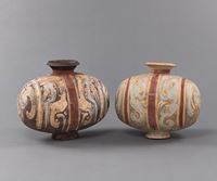 <b>TWO COLD PAINTED COCOON-SHAPED POTTERY URNS</b>