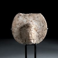 <b>A MARBLE HEAD OF A BODHISATTVA MOUTED ON A METAL STAND</b>