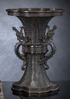 <b>A GU-SHAPED BRONZE VASE IN ARCHAIC STYLE WITH DRAGON HANDLES</b>