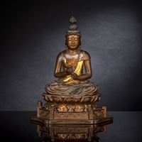 <b>A LACQUERED AND GILT WOOD FIGURE OF KANNON BOSATSU ON A LOTUS</b>