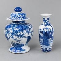 <b>A BLUE AND WHITE PORCELAIN BIRD AND FLOWER VASE AND COVER, AND A FIGURES IN A GARDEN VASE</b>