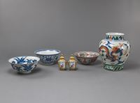 <b>A PAIR OF SMALL LIDDED FAMILLE ROSE VASES, THREE PORCELAIN BOWLS, AND A DOUCAI DRAGON VASE</b>