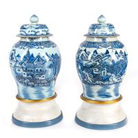 <b>A PAIR OF BLUE AND WHITE PORCELAIN RIVER LANDSCAPE VASES AND COVERS</b>