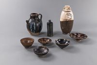 <b>A PHOSPHAT-SPLASHED BLACK-GLAZED EWER, A CIZHOU VASE, FIVE BLACK-GLAZED BOWLS AND A VASE</b>