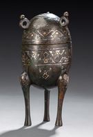 <b>A TRIPOP BRONZE VESSEL AND COVER IN ARCHAIC STYLE WITH GOLD- AND SILVER-INLAYS</b>