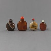 <b>FOUR  AGATE OR STONE SNUFF BOTTLES, TWO WITH CORAL STOPPERS</b>