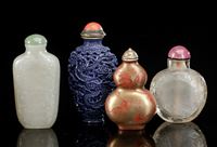 <b>FOUR SNUFFBOTTLES: JADE, CRYSTAL AND TWO PORCELAIN SNUFFBOTTLES</b>