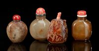 <b>A GROUP OF TWO PLAIN AGATE SNUFF BOTTLES AND TWO CARVED AND INCISED SNUFF BOTTLES WITH BIRD AND FLOWER MOTIF MADE OF AGATE</b>