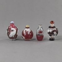 <b>FOUR GLASS SNUFF BOTTLES DECORATED WITH CARP, PHOENIX BIRD A.O. IN COLORED OVERLAY</b>