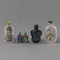 <b>FOUR SNUFF BOTTLES MADE OF GLASS PAINTED ON THE INSIDE, BLACK LACQUER WITH MOTHER-OF-PEARL RESP. PARTLY ENAMELLED SILVER</b>