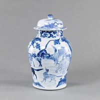 <b>A BLUE AND WHITE PORCELAIN VASE WITH COVER SHOWING VARIOUS MYTHICAL BEASTS</b>