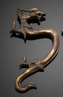 <b>A GILT-BRONZE FITTING OR HANDLE IN SHAPE OF A DRAGON</b>