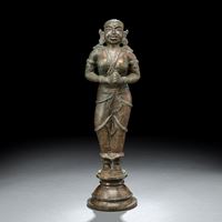 <b>A BRONZE FIGURE OF A WORSHIPPER</b>