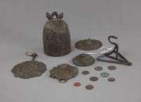 <b>A BRONZE GUANYIN RELIEF BELL AND VARIOUS COINS AND PENDANTS</b>