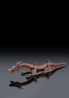 <b>A WOOD ARTICULATED MODEL OF A DRAGON</b>