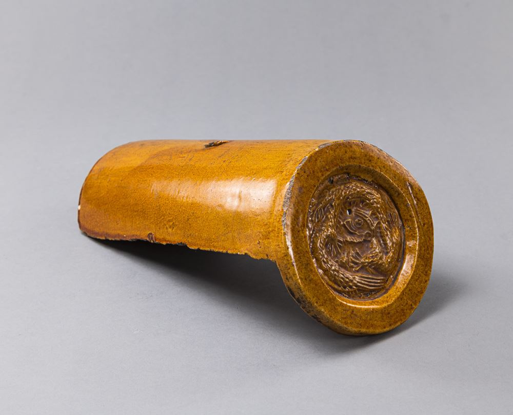 <b>A YELLOW-GLAZED ROOF TILE</b>