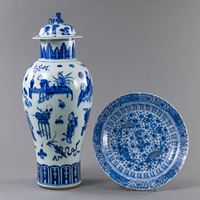 <b>A BLUE AND WHITE FIGURAL VASE AND COVER AND A FISH DISH</b>